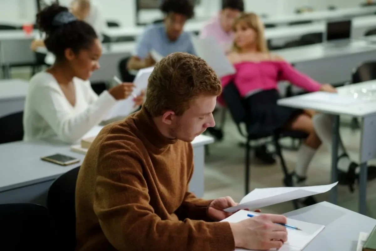 a group of 5 people in a classroom